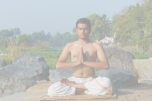 Ellie Smith Yoga Indian Man praying in lotus position