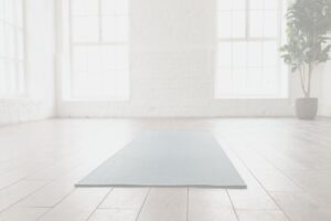 Ellie Smith Yoga natural rubber mat on hardwood floor